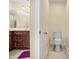 Neutral toned half bath with tiled floor, and a view of the vanity at 3460 Drayton Manor Run, Lawrenceville, GA 30046