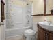Bathroom features a tub and shower combo with a dark vanity at 3460 Drayton Manor Run, Lawrenceville, GA 30046