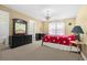 Bedroom with warm lighting, a double bed, and a large mirror at 3460 Drayton Manor Run, Lawrenceville, GA 30046