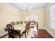 Dining room with hardwood floors, natural light and view into the living room at 3460 Drayton Manor Run, Lawrenceville, GA 30046