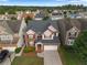 Charming two-story brick home with a well-manicured lawn and attached two-car garage at 3460 Drayton Manor Run, Lawrenceville, GA 30046