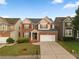 Charming two-story brick home with a well-manicured lawn and attached two-car garage at 3460 Drayton Manor Run, Lawrenceville, GA 30046