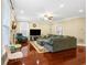 Cozy living room with hardwood floors, recessed lighting, a fireplace, and large windows at 3460 Drayton Manor Run, Lawrenceville, GA 30046