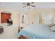 Spacious main bedroom featuring an office space, neutral tones, and ensuite bathroom and laundry room access at 3460 Drayton Manor Run, Lawrenceville, GA 30046