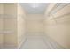 Large walk-in closet with multiple levels of shelving for maximum storage space at 3460 Drayton Manor Run, Lawrenceville, GA 30046
