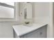 Bathroom featuring white countertops, tile backsplash and a gray vanity at 4282 Roswell Ne Rd # K3, Atlanta, GA 30342