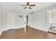Bedroom with hardwood floors and an en-suite bathroom with white tile at 4282 Roswell Ne Rd # K3, Atlanta, GA 30342