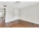 This bedroom features hardwood floors, a neutral color scheme, and a ceiling fan with a light at 4282 Roswell Ne Rd # K3, Atlanta, GA 30342