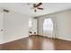Bedroom with hardwood floors, ceiling fan, and natural light from the window at 4282 Roswell Ne Rd # K3, Atlanta, GA 30342