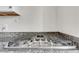 Gourmet stainless steel gas cooktop featuring granite countertops and modern fixtures at 4282 Roswell Ne Rd # K3, Atlanta, GA 30342