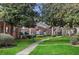 Well-maintained apartment complex with manicured lawns and mature trees at 4282 Roswell Ne Rd # K3, Atlanta, GA 30342