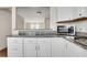 Kitchen featuring granite countertops and stainless steel appliances with pass through to the living room at 4282 Roswell Ne Rd # K3, Atlanta, GA 30342