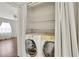 A laundry area features a washing machine and dryer in a closet with white folding doors at 4282 Roswell Ne Rd # K3, Atlanta, GA 30342