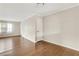 Bright living room features hardwood floors, neutral walls and baseboards, and interior doors at 4282 Roswell Ne Rd # K3, Atlanta, GA 30342