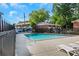 Community pool surrounded by lounge chairs and lush greenery, perfect for relaxation at 4282 Roswell Ne Rd # K3, Atlanta, GA 30342