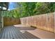 Wooden back deck with matching stained privacy fence and wood floor at 884 Edgewater Cir, Marietta, GA 30062
