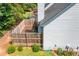 Aerial backyard view shows a wooden deck, partial siding, and manicured garden at 884 Edgewater Cir, Marietta, GA 30062