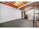 Unfinished basement with visible ceiling, laundry machines, and black rubber floor at 884 Edgewater Cir, Marietta, GA 30062
