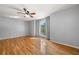 Serene bedroom featuring hardwood floors, neutral walls, and a ceiling fan at 884 Edgewater Cir, Marietta, GA 30062