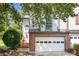 Charming two-story home with a brick-accented garage, steps to a beautiful front door, and landscaped yard at 884 Edgewater Cir, Marietta, GA 30062