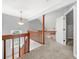 Second story hallway with neutral carpet and white doors at 884 Edgewater Cir, Marietta, GA 30062