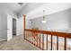Second story hallway with views of the staircase and neutral carpet at 884 Edgewater Cir, Marietta, GA 30062