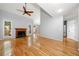 Spacious living room boasts hardwood floors, a fireplace, large windows, and a vaulted ceiling at 884 Edgewater Cir, Marietta, GA 30062