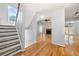 Inviting living room with hardwood floors, staircase, fireplace, and backyard access at 884 Edgewater Cir, Marietta, GA 30062