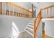Carpeted staircase with wood railing leading to the second story of the home at 884 Edgewater Cir, Marietta, GA 30062