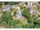 An aerial view of a home nestled among lush trees in a suburban neighborhood at 1120 Bagwell Dr, Kennesaw, GA 30152