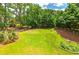 Sprawling backyard with mature trees and a well-kept lawn, offering ample space for recreation and relaxation at 1120 Bagwell Dr, Kennesaw, GA 30152