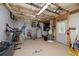 Unfinished basement with exposed ceiling, exercise equipment, and sports gear at 1120 Bagwell Dr, Kennesaw, GA 30152