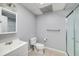 Bathroom featuring a vanity sink, toilet, and a stand up shower with glass door at 1120 Bagwell Dr, Kennesaw, GA 30152