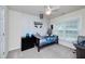 Cozy bedroom with gray carpet and light colored brick accent wall at 1120 Bagwell Dr, Kennesaw, GA 30152