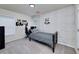 This bedroom is decorated with a gray brick wall, gaming-themed decor, plush carpet, and a built-in desk at 1120 Bagwell Dr, Kennesaw, GA 30152