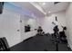 Basement gym featuring an exercise machine, rubber floor, weights, and mirror at 1120 Bagwell Dr, Kennesaw, GA 30152