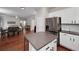 Open floor plan showing a modern kitchen with stainless steel appliances and an island at 1120 Bagwell Dr, Kennesaw, GA 30152