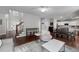 Open-concept living space with a kitchen, dining area, and comfortable seating under a ceiling fan at 1120 Bagwell Dr, Kennesaw, GA 30152