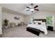Spacious main bedroom boasts tray ceiling, ceiling fan, carpet floor, and plentiful of natural light from many windows at 1120 Bagwell Dr, Kennesaw, GA 30152