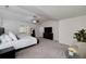 A luxurious main bedroom with a ceiling fan, ensuite bathroom, and large windows for plenty of sunlight at 1120 Bagwell Dr, Kennesaw, GA 30152