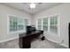 Bright home office featuring lots of natural light from large windows and neutral colored walls at 1120 Bagwell Dr, Kennesaw, GA 30152