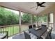 Screened-in porch with a dining table and a view of the trees at 1120 Bagwell Dr, Kennesaw, GA 30152