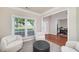 Comfortable sitting area with hardwood floors, an inviting window, and stylish decor at 1120 Bagwell Dr, Kennesaw, GA 30152