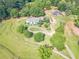 Expansive property featuring a home with a circular driveway and lush green landscaping at 2229 S Van Wert S Rd, Villa Rica, GA 30180
