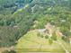 Aerial shot of a tree-lined neighborhood with a large lake nearby at 2229 S Van Wert S Rd, Villa Rica, GA 30180