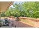Wooden deck features outdoor seating and grill overlooking a serene wooded yard at 2229 S Van Wert S Rd, Villa Rica, GA 30180