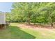 Picturesque backyard with mature trees and sprawling lawn at 2229 S Van Wert S Rd, Villa Rica, GA 30180