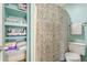 Cozy bathroom with built-in shelves, patterned shower curtain, and modern fixtures at 2229 S Van Wert S Rd, Villa Rica, GA 30180