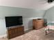 Bedroom with TV, two wooden dressers, soft carpet, and a comfortable atmosphere at 2229 S Van Wert S Rd, Villa Rica, GA 30180