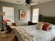Bright bedroom with large windows, ceiling fan, soft carpet, and cozy decor at 2229 S Van Wert S Rd, Villa Rica, GA 30180